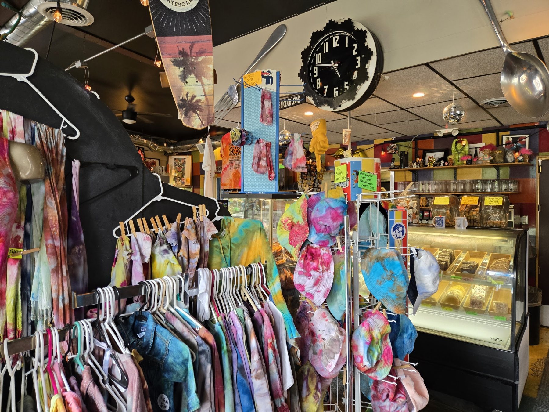 Racks of clothing and gifts inside the cafe